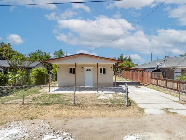 a house with trees in the background