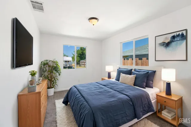 a bedroom with bed and window