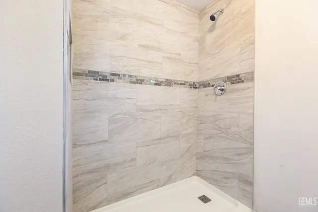 a bathroom with a toilet a sink a mirror and vanity