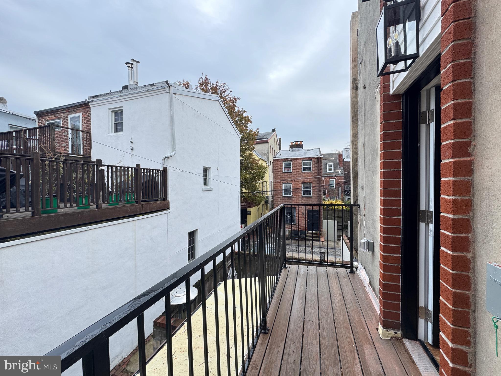 781 South 3rd Street, Unit 2 Philadelphia, PA 19147 - Photo 15 of 17 a view of a balcony with wooden floor and stairs