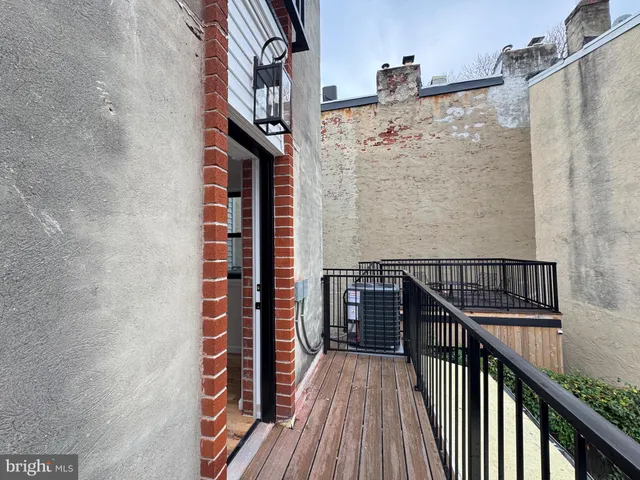 a view of balcony with wooden floor