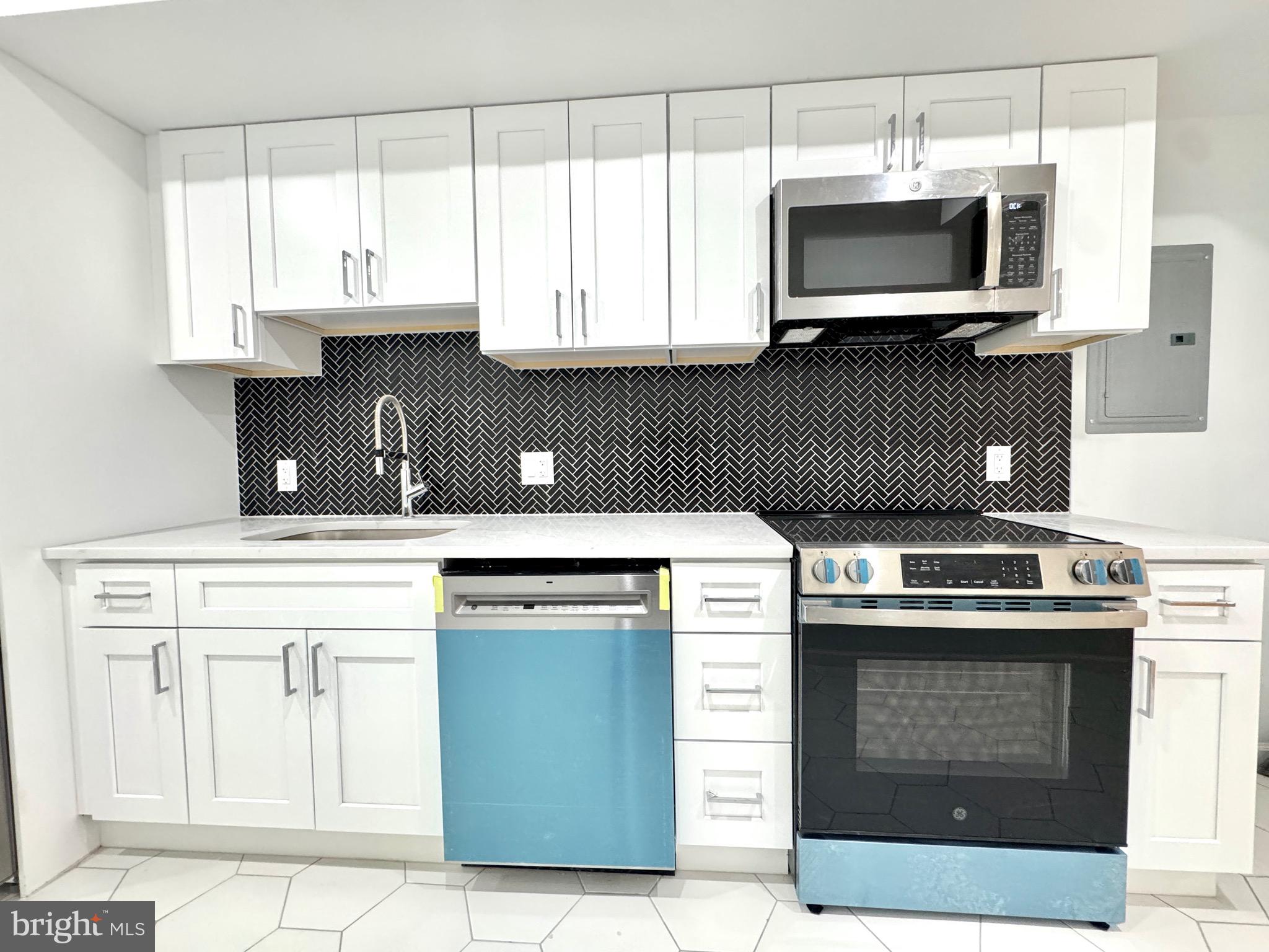 781 South 3rd Street, Unit 2 Philadelphia, PA 19147 - Photo 5 of 17 a kitchen with a stove and a microwave