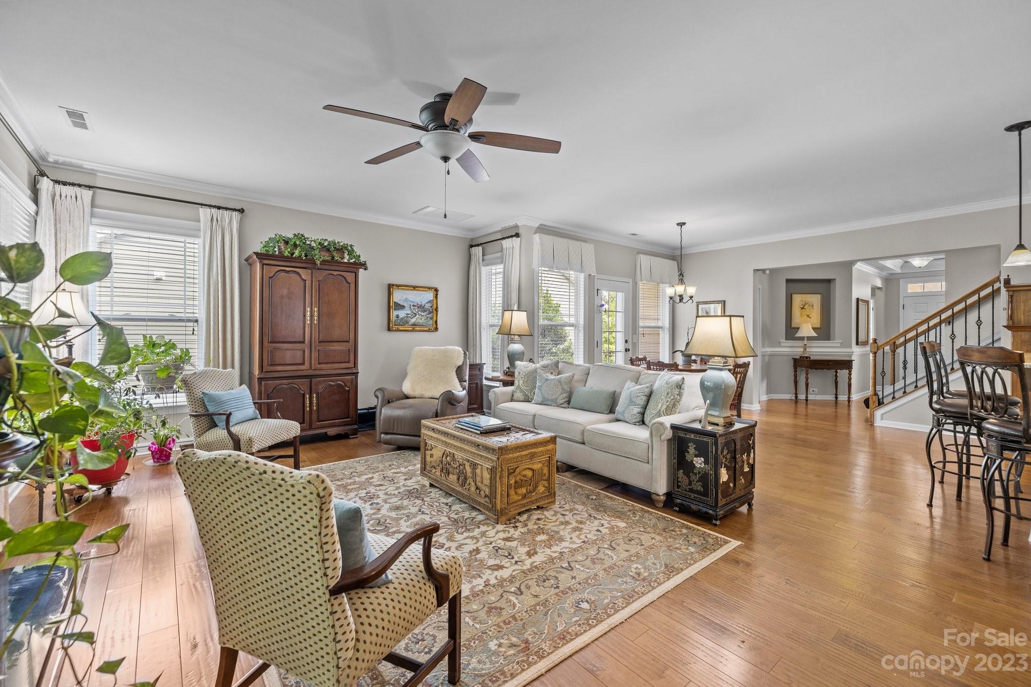 141 Hawks Creek Parkway Fort Mill, SC 29708 - Photo 16 of 44 a living room with furniture wooden floor and a potted plant