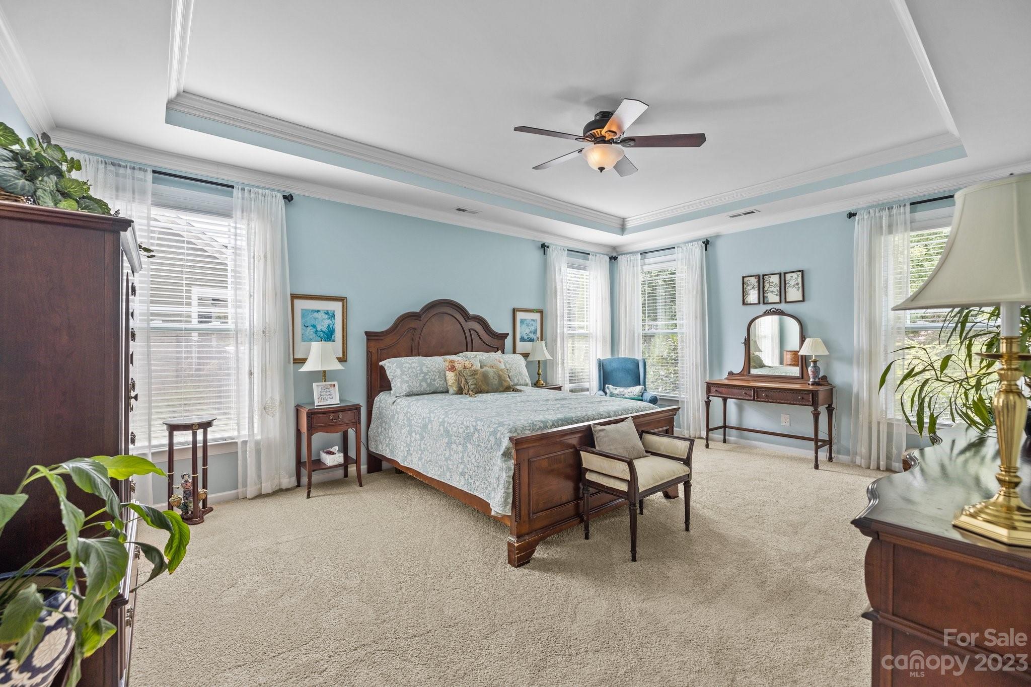 141 Hawks Creek Parkway Fort Mill, SC 29708 - Photo 18 of 44 a bedroom with a bed and a chandelier