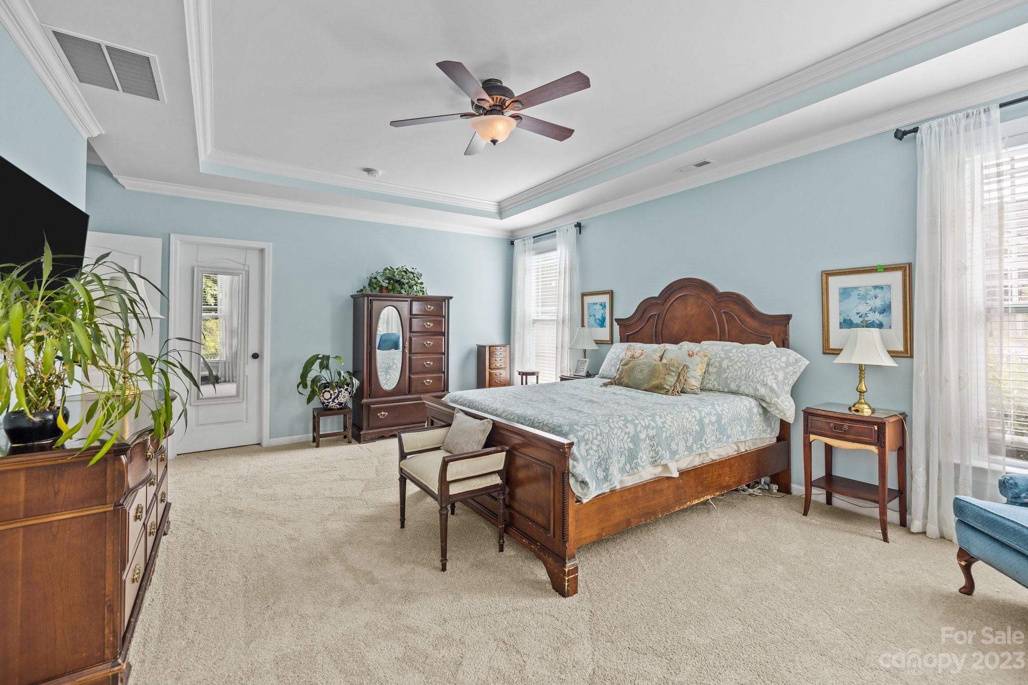 141 Hawks Creek Parkway Fort Mill, SC 29708 - Photo 19 of 44 a bedroom with a bed and ceiling fan