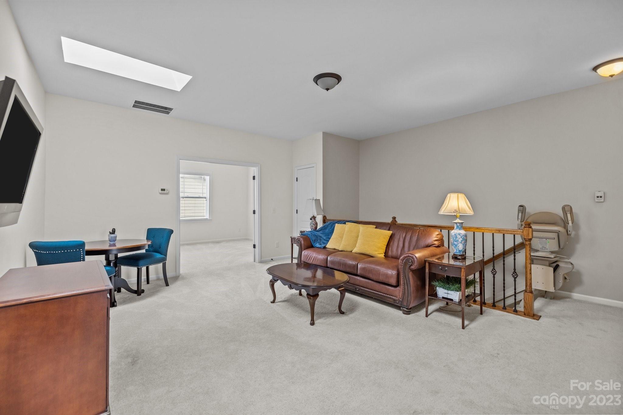 141 Hawks Creek Parkway Fort Mill, SC 29708 - Photo 23 of 44 a living room with furniture and a flat screen tv