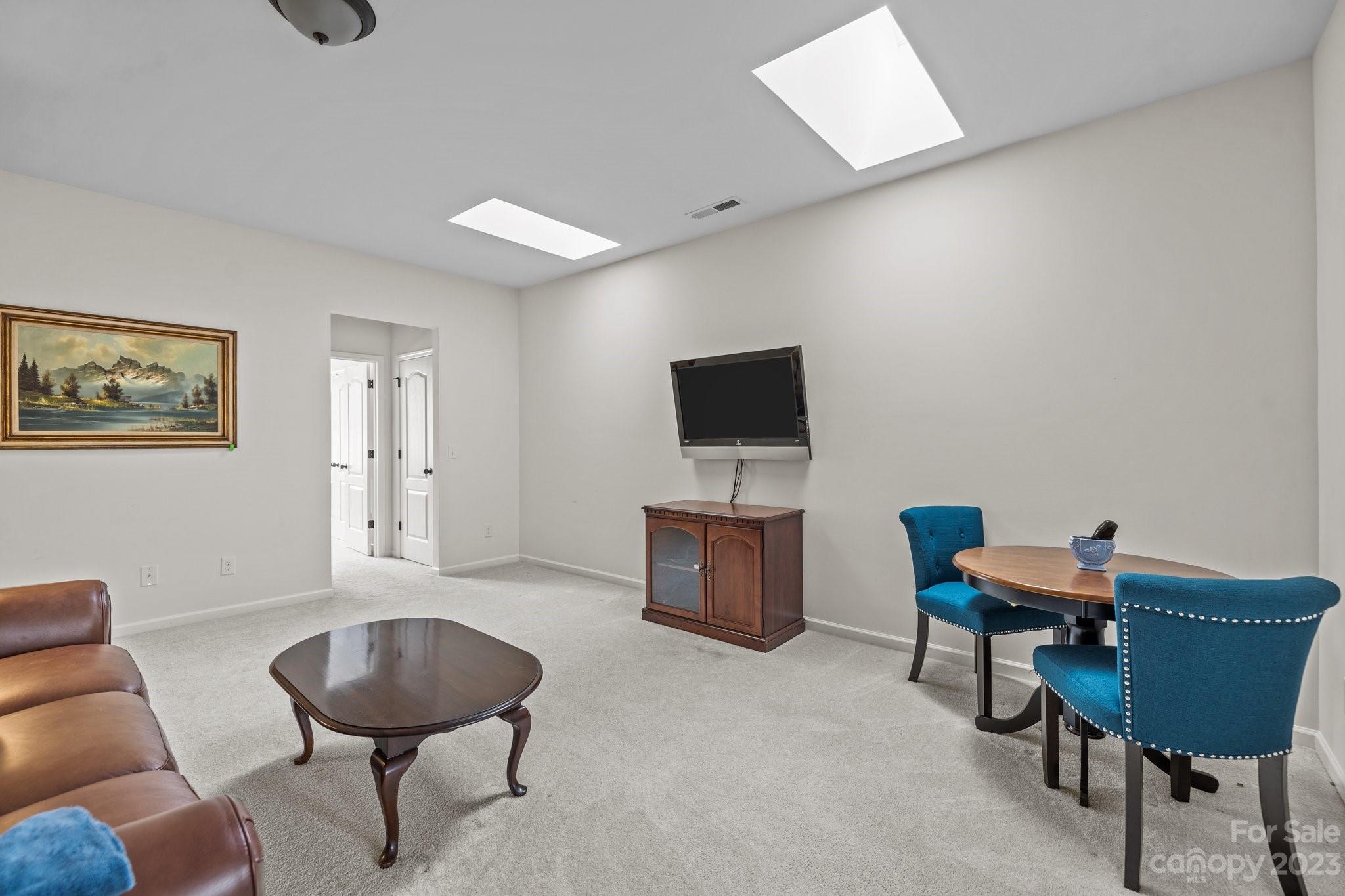 141 Hawks Creek Parkway Fort Mill, SC 29708 - Photo 24 of 44 a living room with furniture and a flat screen tv