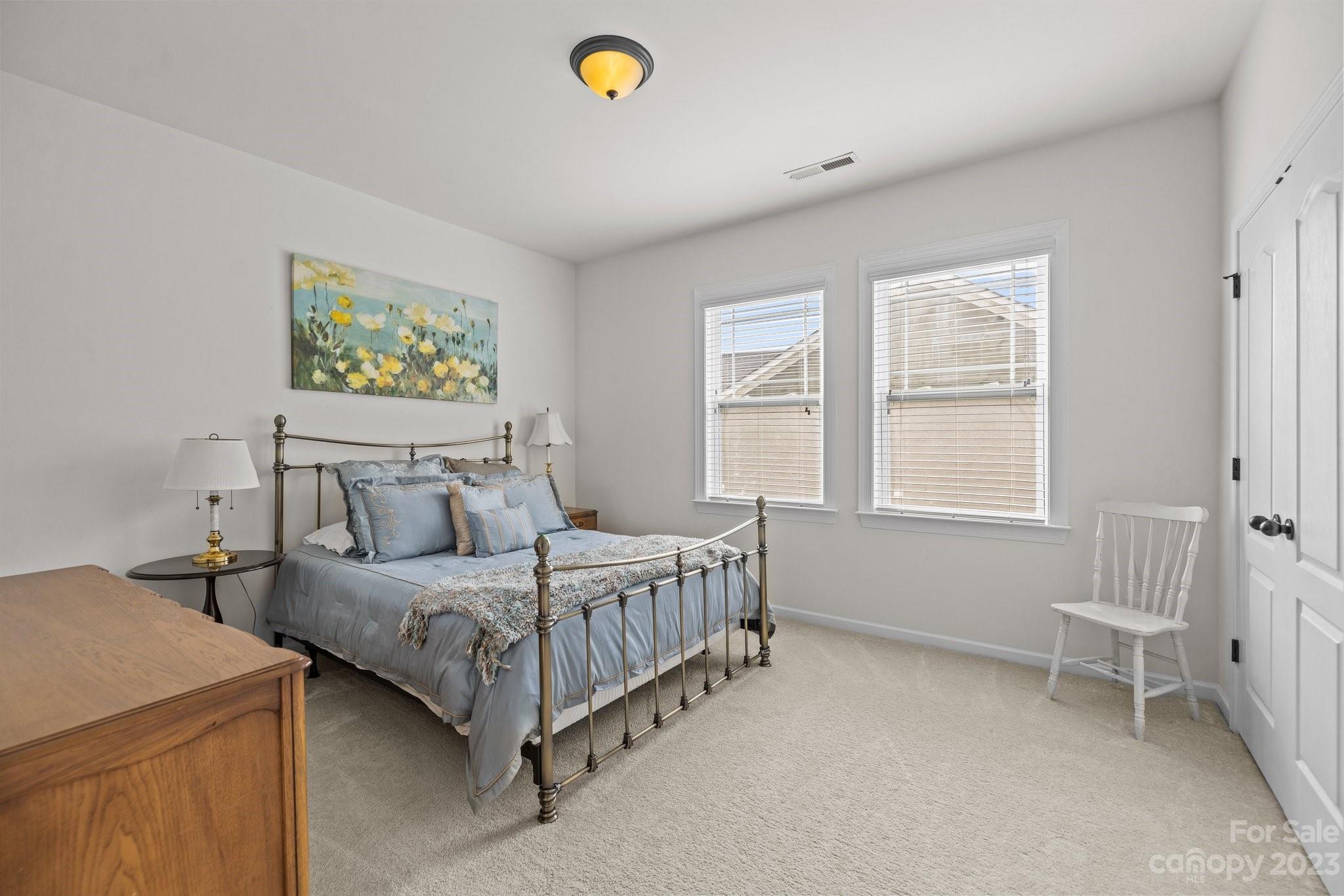 141 Hawks Creek Parkway Fort Mill, SC 29708 - Photo 25 of 44 a bedroom with a bed and a window