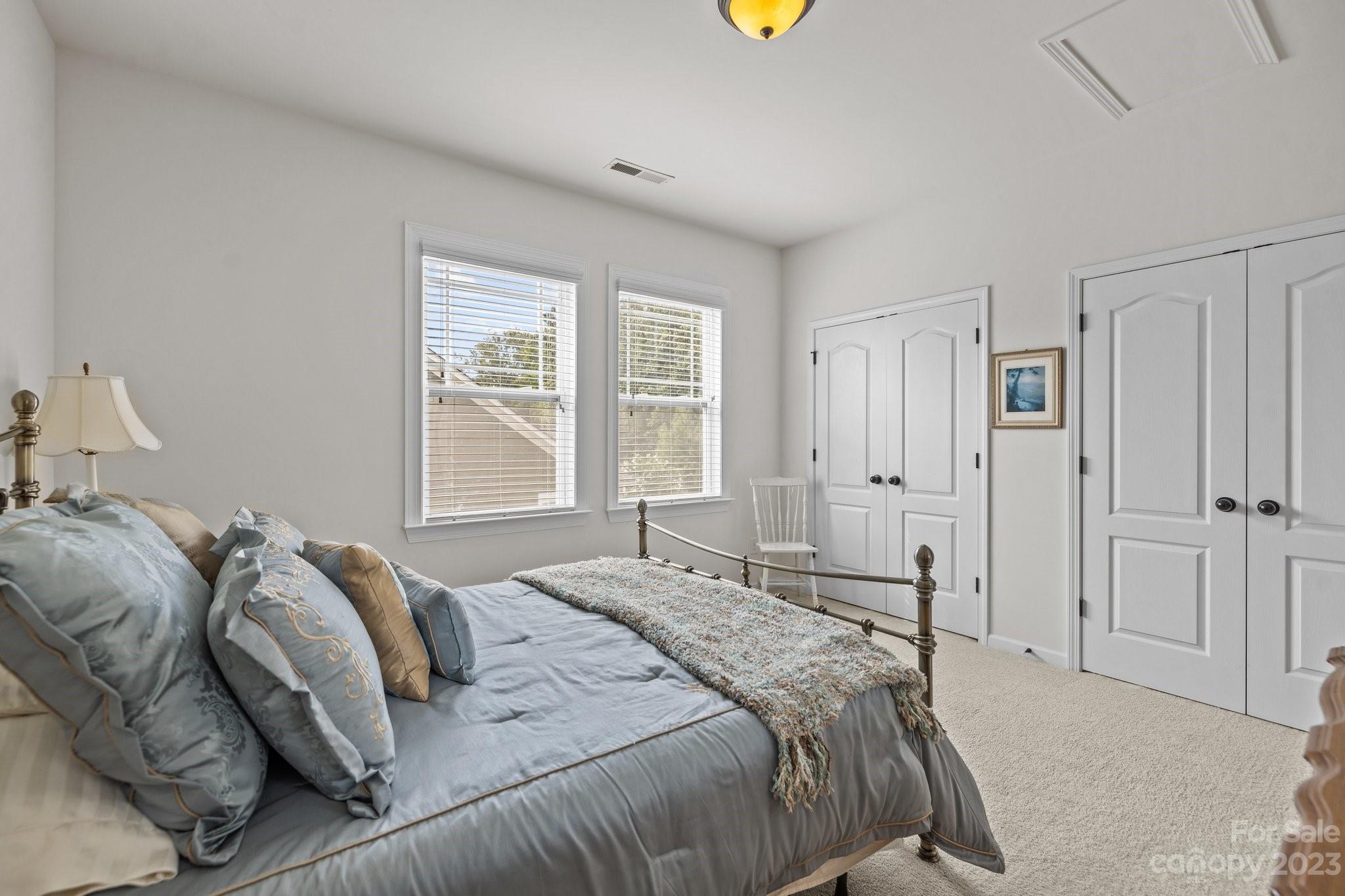 141 Hawks Creek Parkway Fort Mill, SC 29708 - Photo 26 of 44 a bedroom with a bed and a window