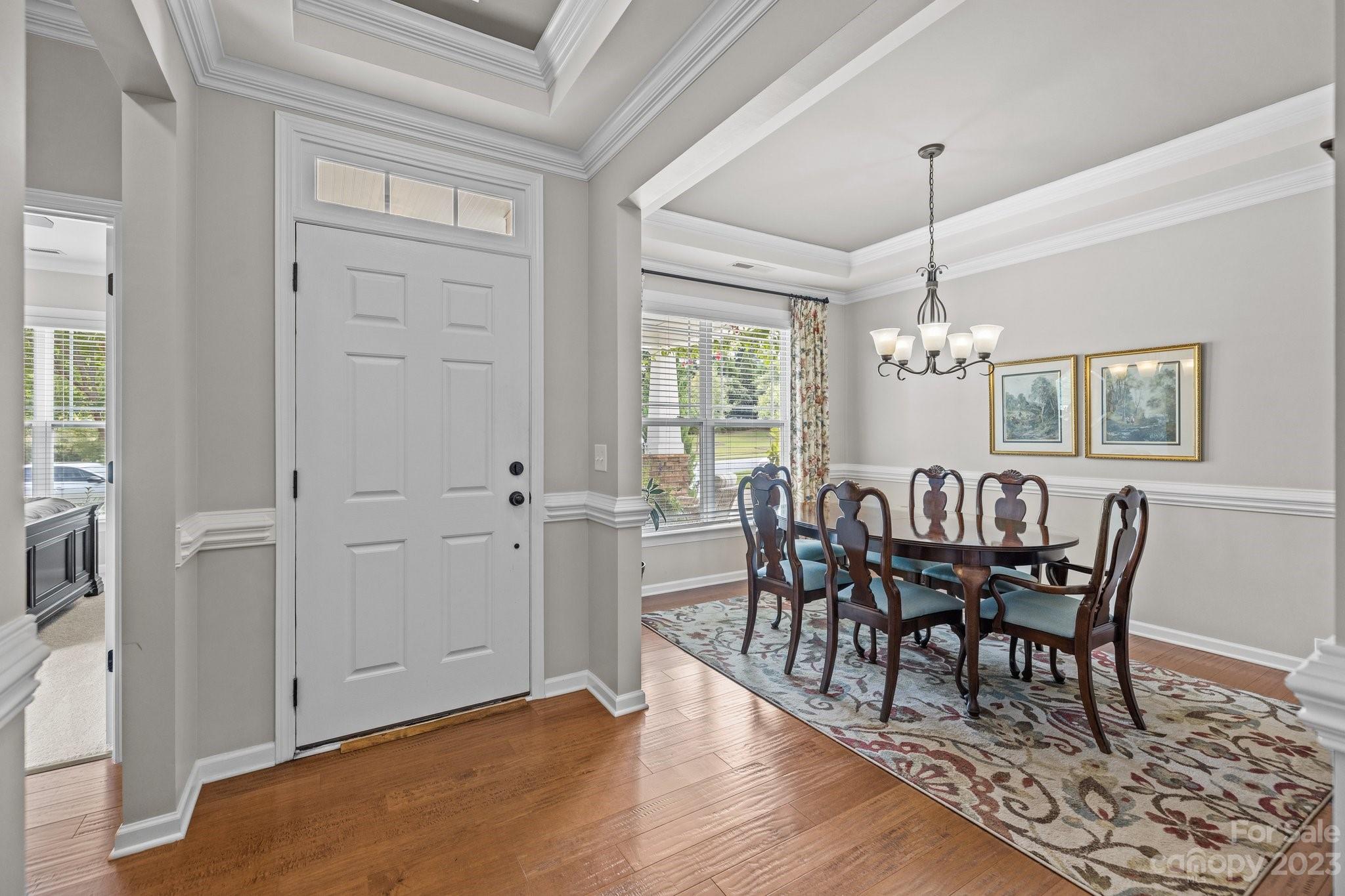 141 Hawks Creek Parkway Fort Mill, SC 29708 - Photo 3 of 44 a view of a dining room with furniture window and wooden floor