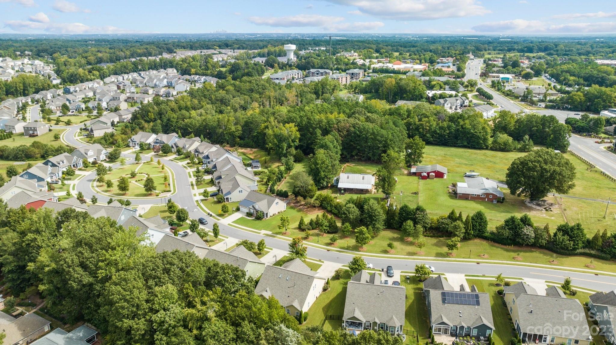 141 Hawks Creek Parkway Fort Mill, SC 29708 - Photo 42 of 44 an aerial view of residential houses with outdoor space and trees