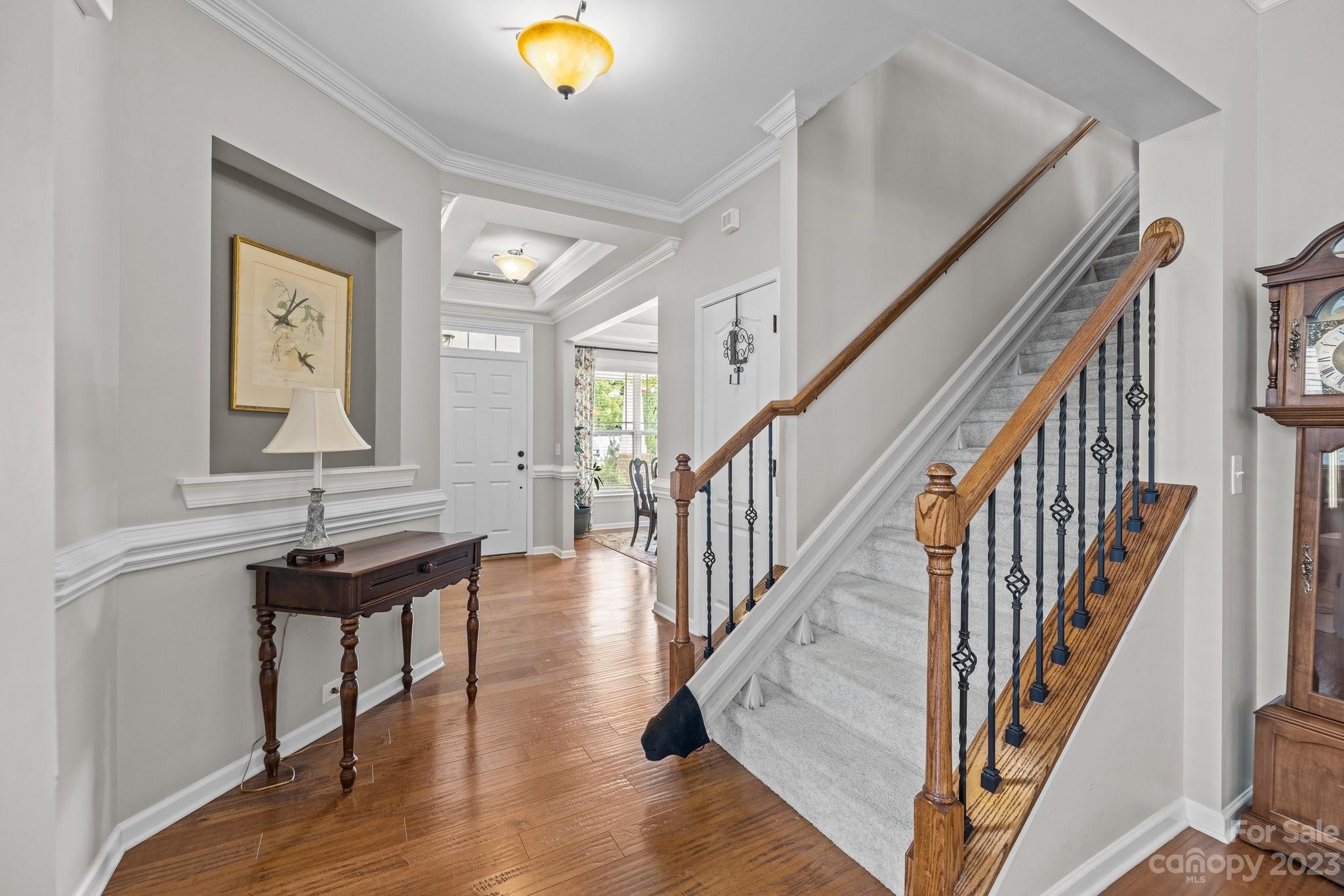 141 Hawks Creek Parkway Fort Mill, SC 29708 - Photo 5 of 44 a view of a hallway with wooden floor and staircase
