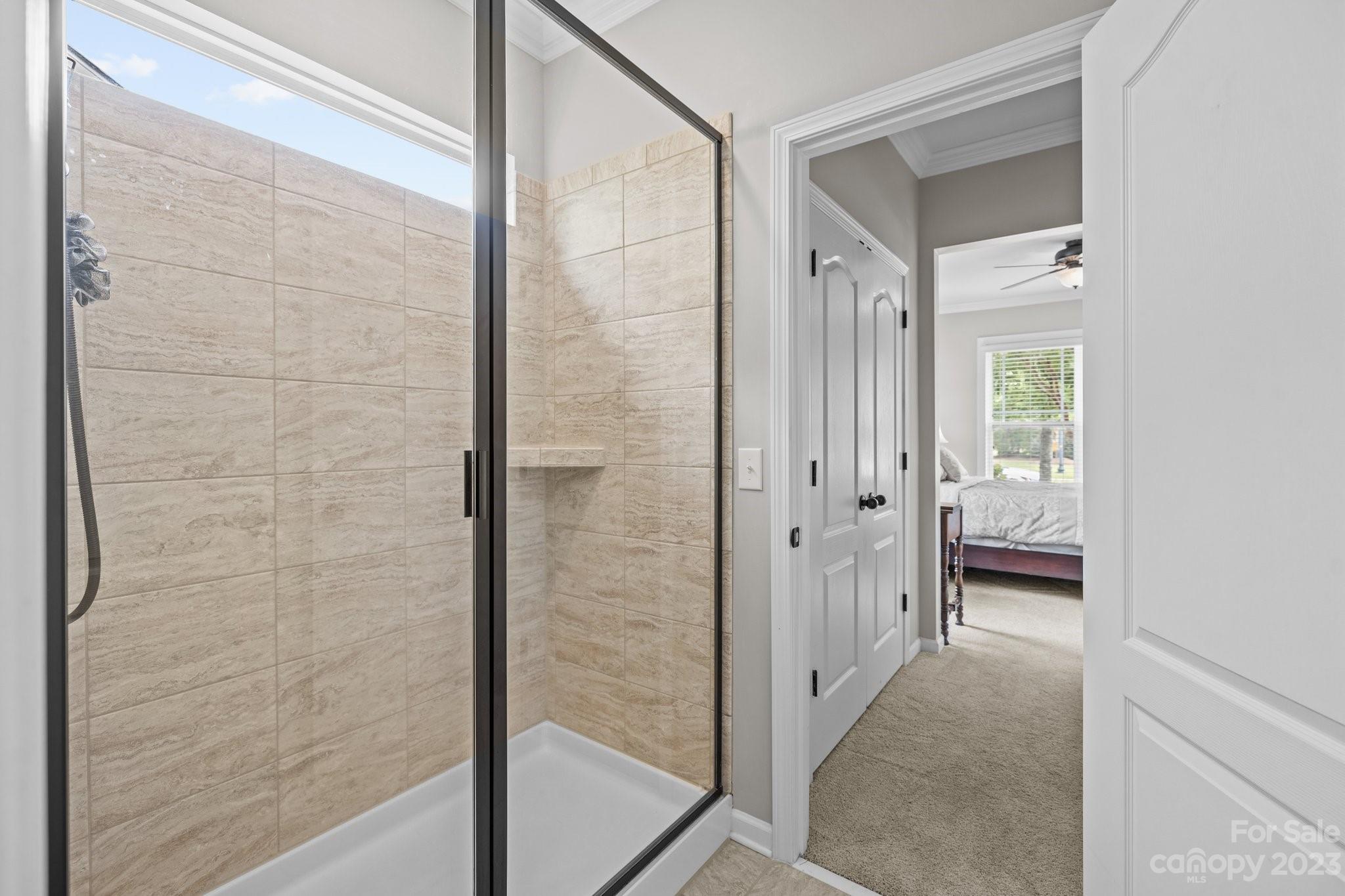 141 Hawks Creek Parkway Fort Mill, SC 29708 - Photo 8 of 44 a bathroom with a glass shower door