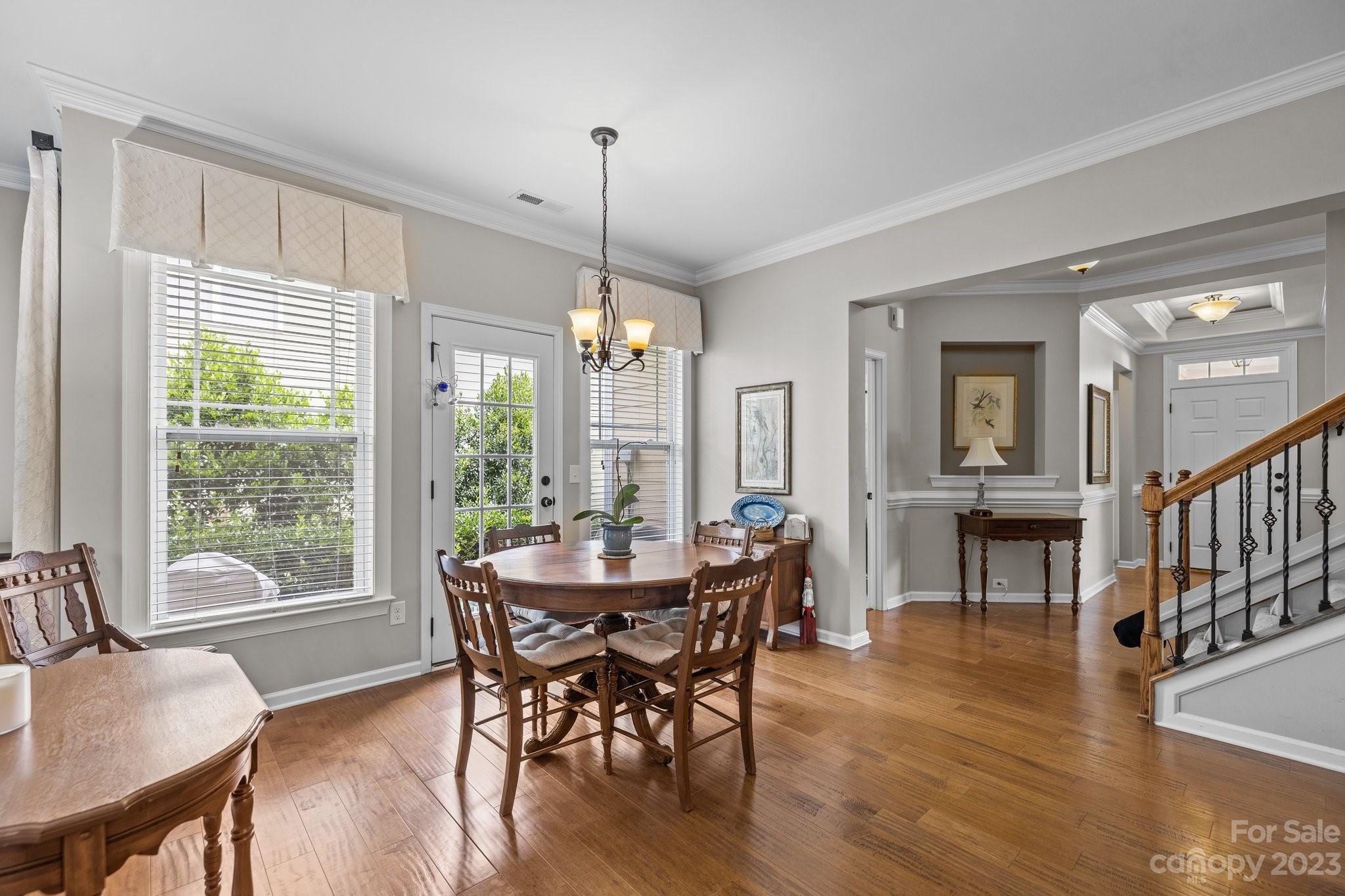 141 Hawks Creek Parkway Fort Mill, SC 29708 - Photo 9 of 44 a view of a dining room with furniture window and wooden floor
