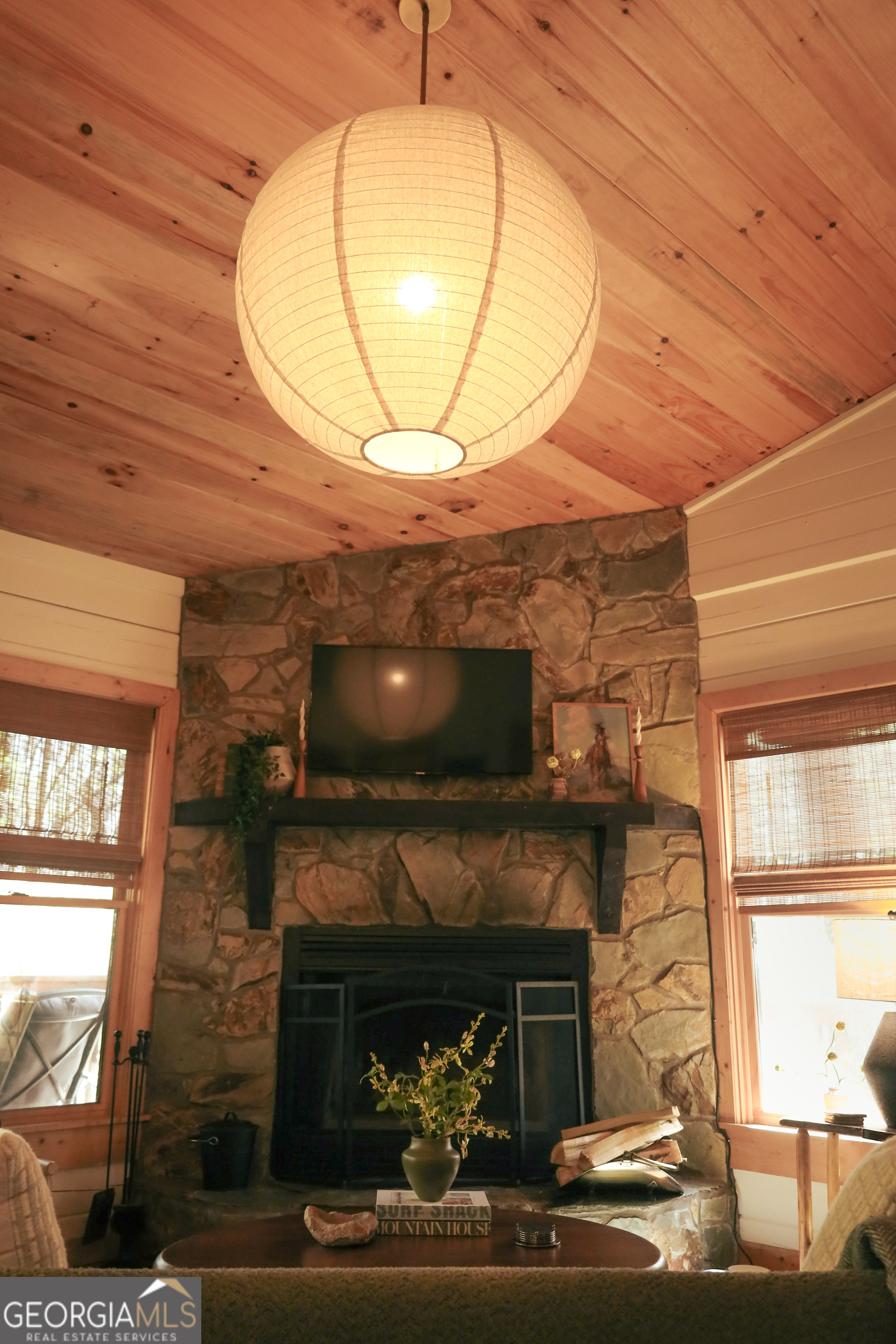 7 Ascherman Court Blue Ridge, GA 30513 - Photo 4 of 41 a living room with a fireplace and a wooden floor