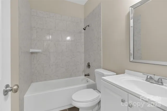 a bathroom with a sink a toilet and a bathtub