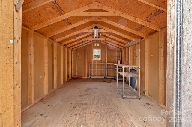 a view of a hallway with wooden walls