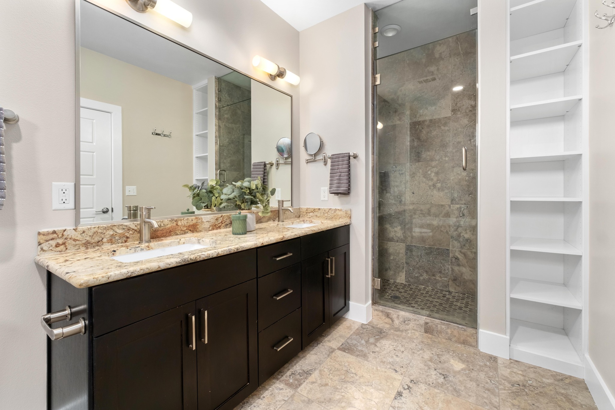 1615 East 7th Street, Unit 402 Austin, TX 78702 - Photo 11 of 23 a bathroom with a sink double vanity and a shower
