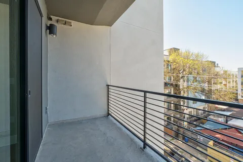a view of a balcony with city view