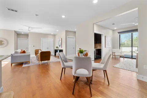 a view of a dining room with furniture window and wooden floor