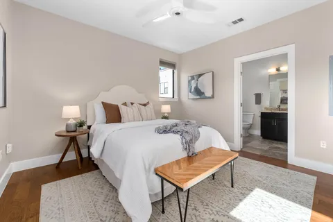 a bedroom with a bed and a table