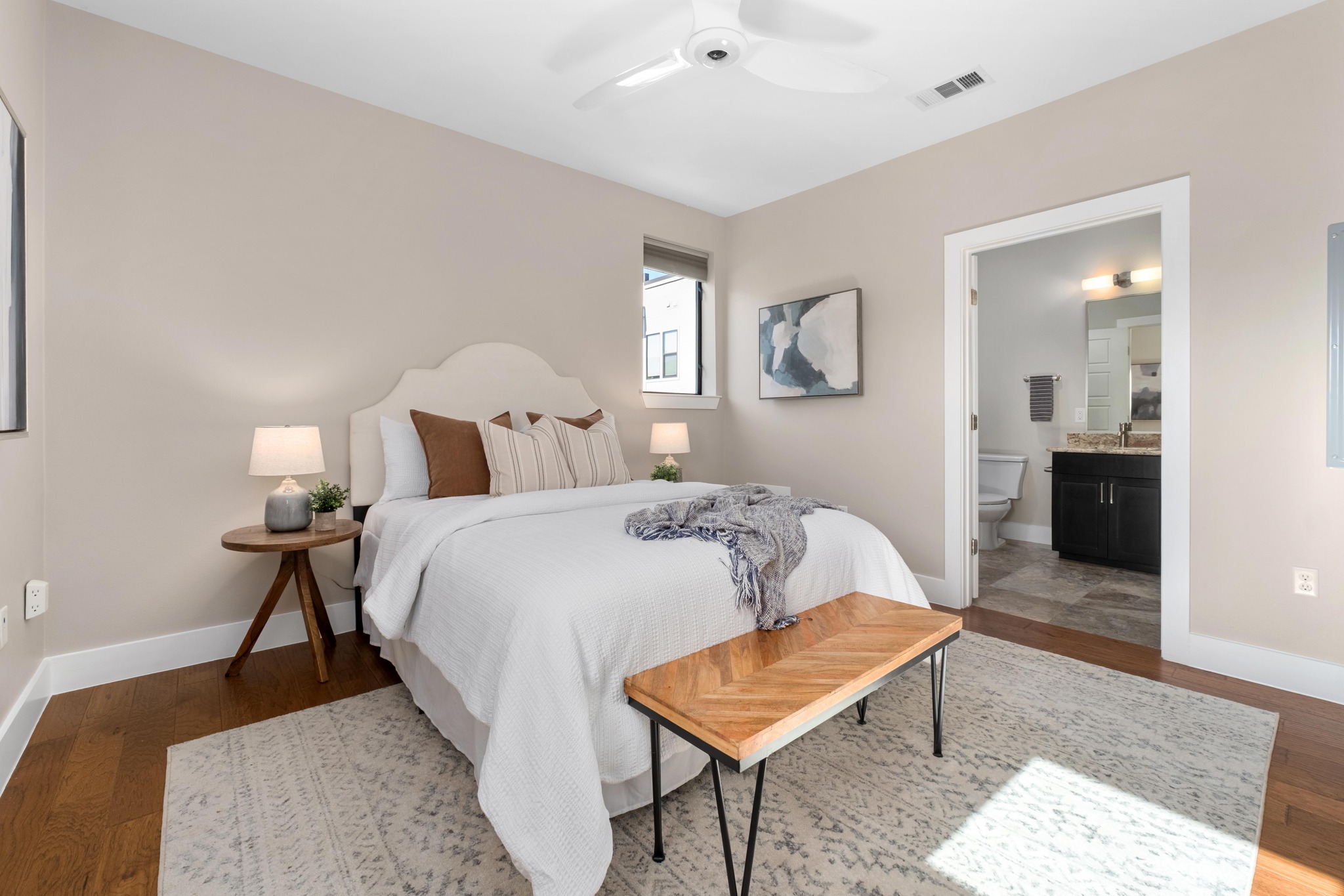 1615 East 7th Street, Unit 402 Austin, TX 78702 - Photo 10 of 23 a bedroom with a bed and a table