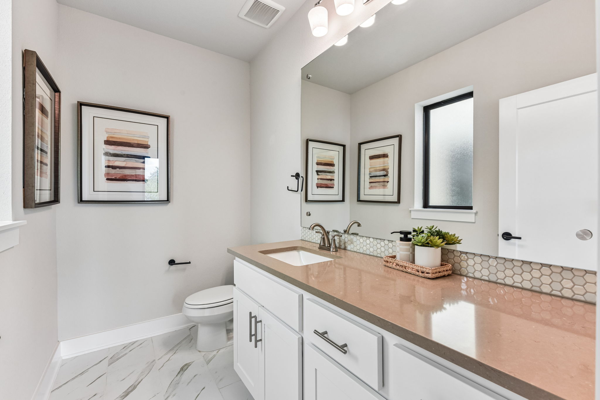 9101 Cattle Baron Path Austin, TX 78747 - Photo 17 of 40 Refined bathroom with an elongated vanity and stylish tile flooring.