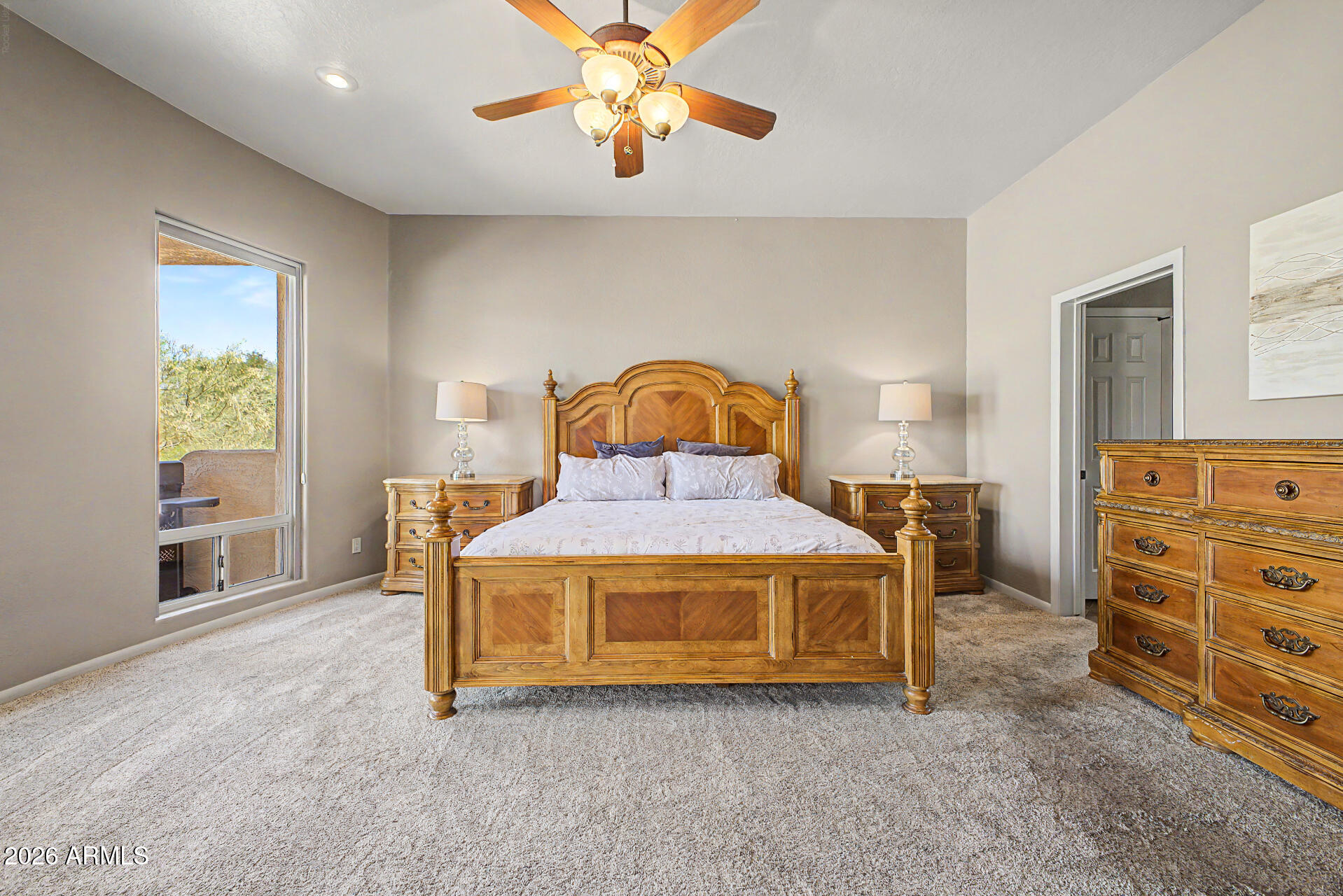 27909 North Quail Spring Road Rio Verde, AZ 85263 - Photo 18 of 52 a bedroom with a bed and a chandelier