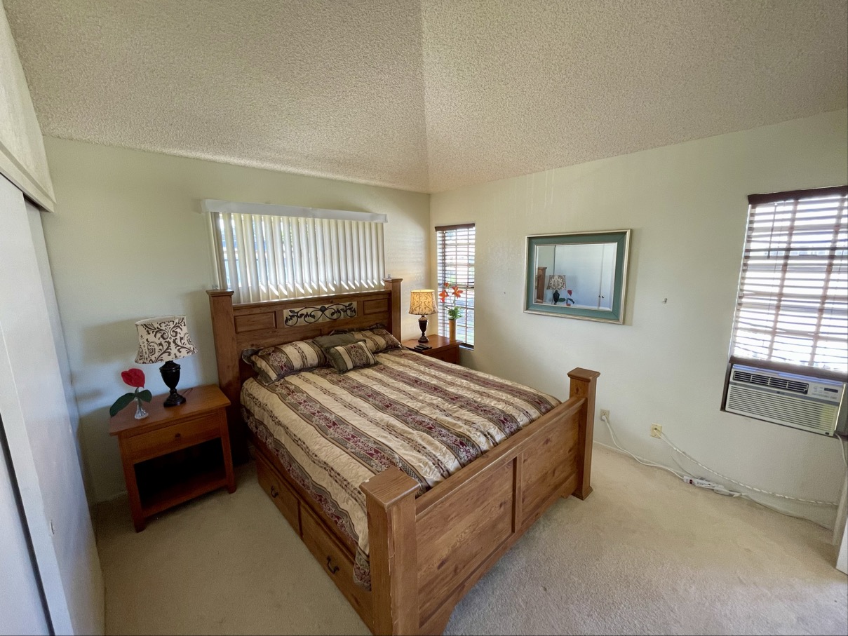 68-3883 Lua Kula Street, Unit 2005 Waikoloa, HI 96738 - Photo 18 of 28 a bed room with a bed and window