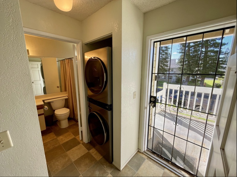 68-3883 Lua Kula Street, Unit 2005 Waikoloa, HI 96738 - Photo 2 of 28 a view of a hallway with washer and dryer