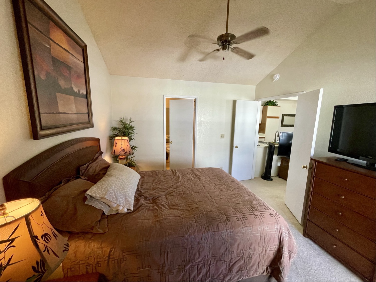 68-3883 Lua Kula Street, Unit 2005 Waikoloa, HI 96738 - Photo 24 of 28 a bedroom with a bed and a flat screen tv