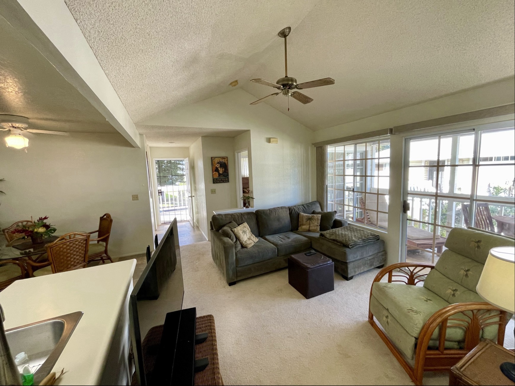 68-3883 Lua Kula Street, Unit 2005 Waikoloa, HI 96738 - Photo 6 of 28 a living room with furniture and a chandelier