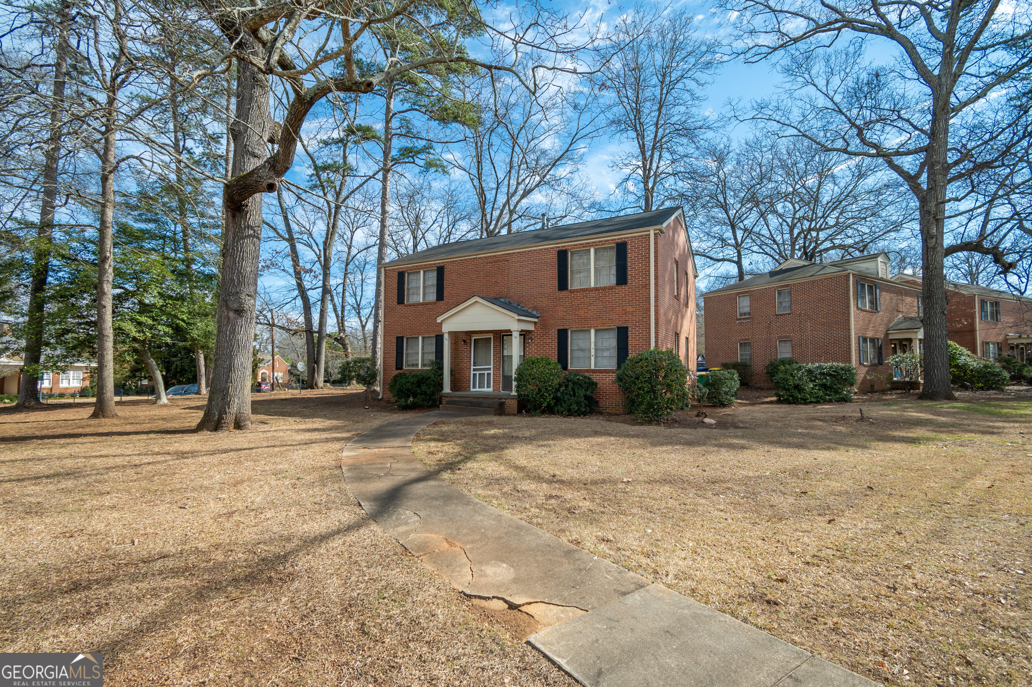 118 University Drive Athens, GA 30605 - Photo 20 of 29 a front view of a house with a yard and garage