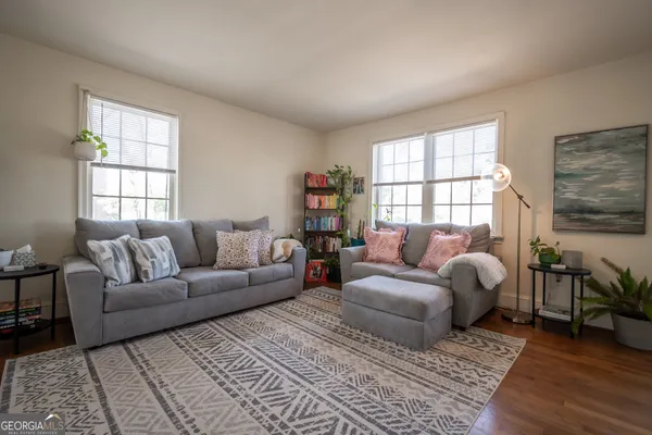a living room with furniture and a window