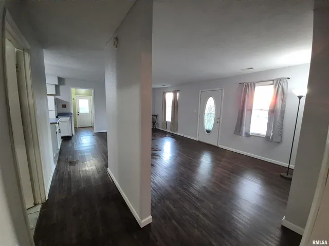 wooden floor in a hall with an entryway