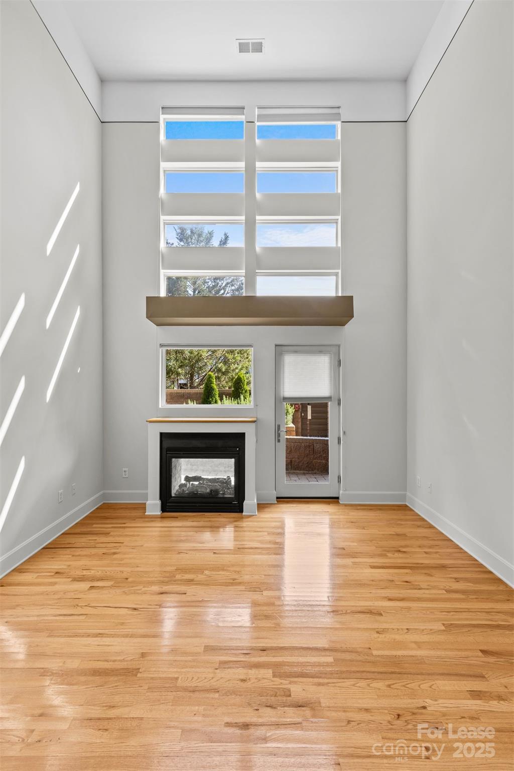 420 Queens Road, Unit 7 Charlotte, NC 28207 - Photo 15 of 46 a view of an empty room with a window and fire place