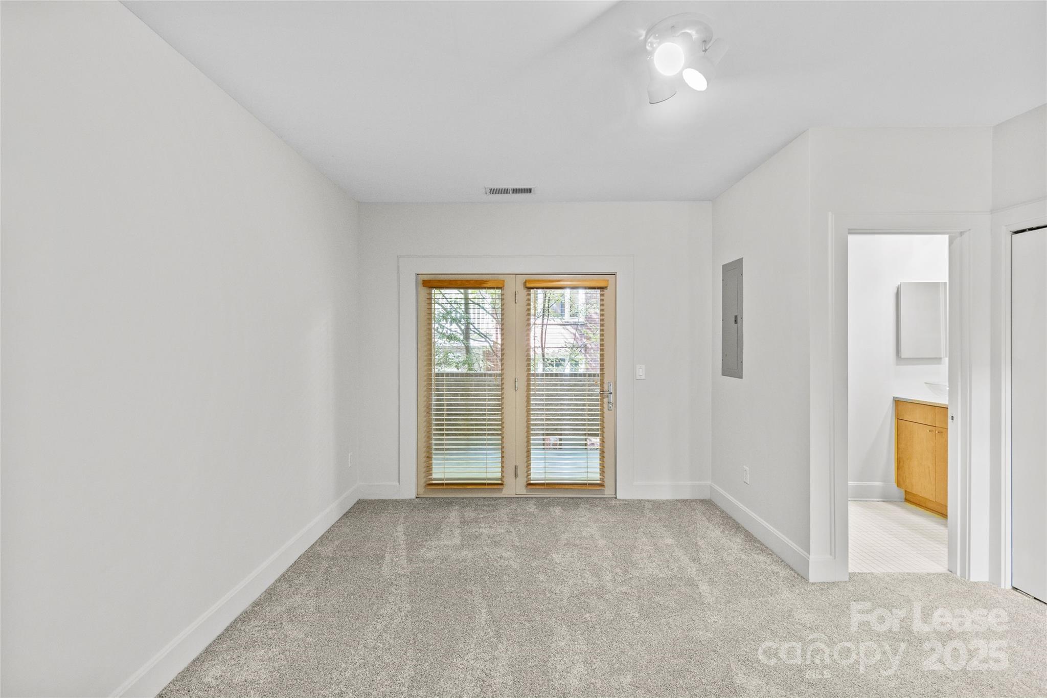 420 Queens Road, Unit 7 Charlotte, NC 28207 - Photo 19 of 46 an empty room with windows