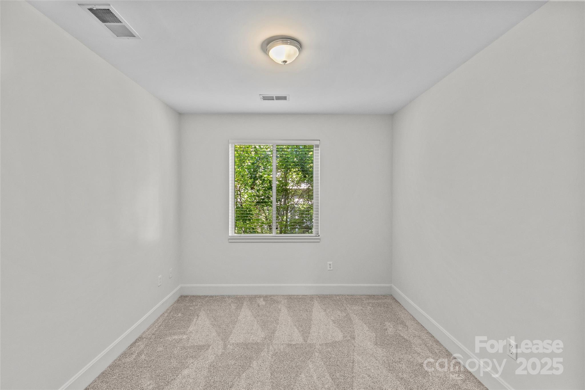 420 Queens Road, Unit 7 Charlotte, NC 28207 - Photo 41 of 46 an empty room with a window