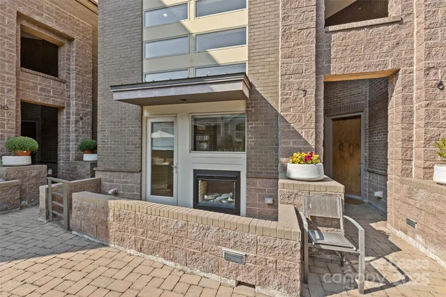 a front view of a house with outdoor seating