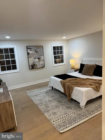 a bedroom with a bed and a couch