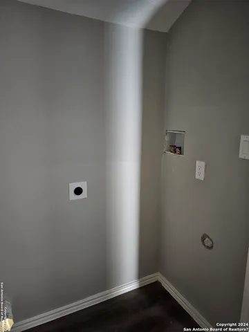 an empty room with wooden floor