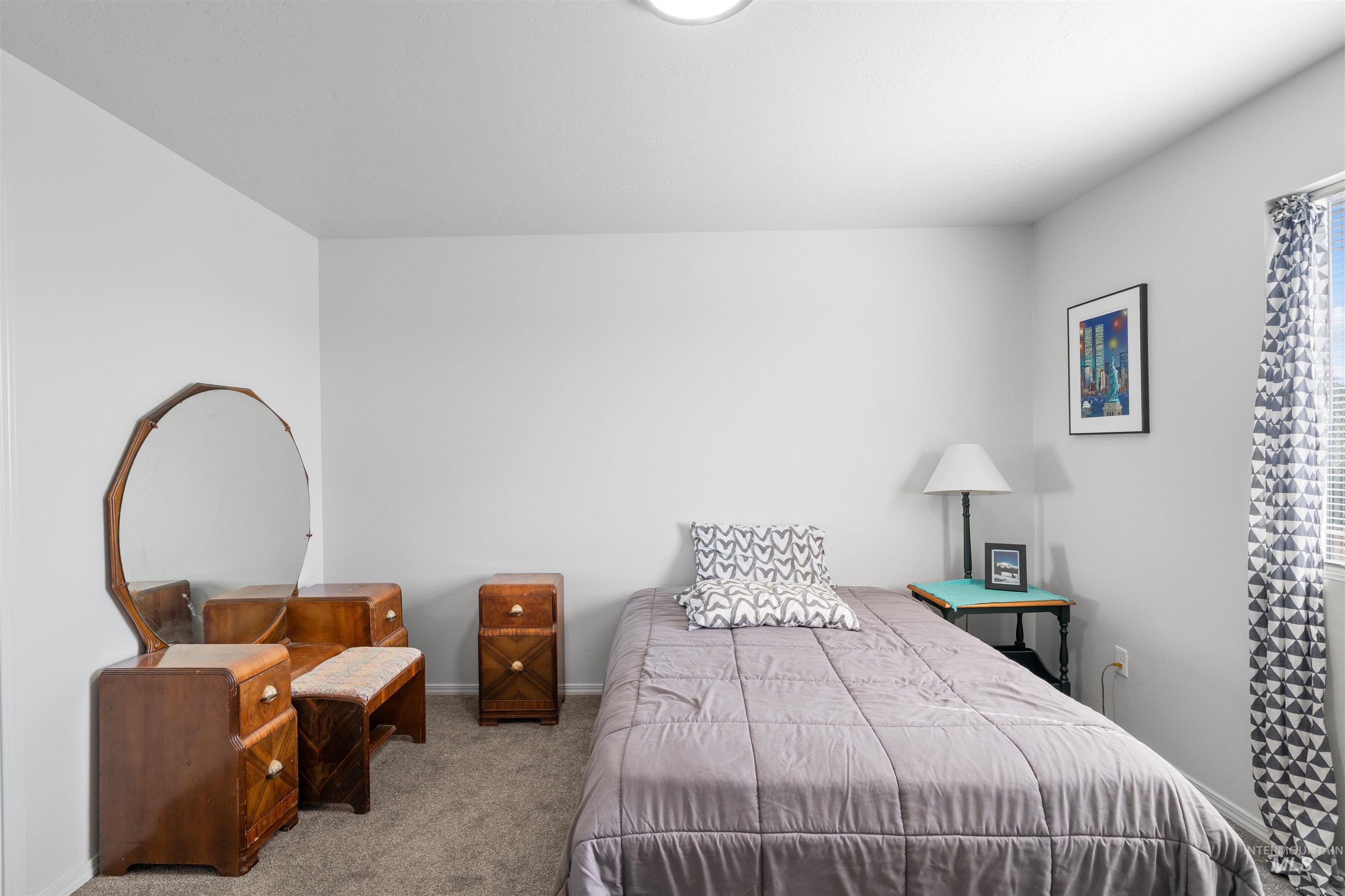 12731 Sondra Street Caldwell, ID 83607 - Photo 27 of 46 Carpeted bedroom with baseboards