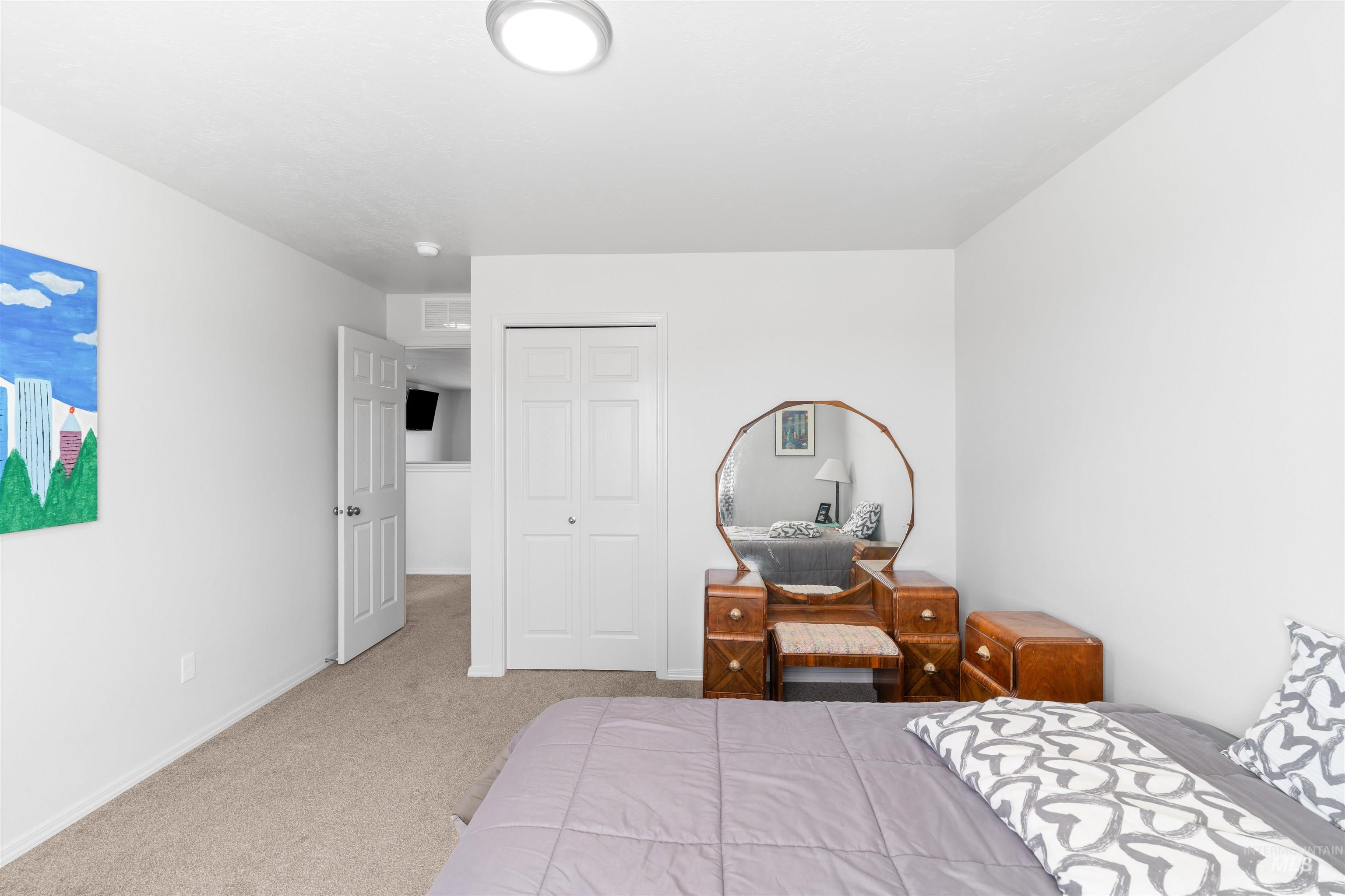 12731 Sondra Street Caldwell, ID 83607 - Photo 28 of 46 Carpeted bedroom with a closet and baseboards
