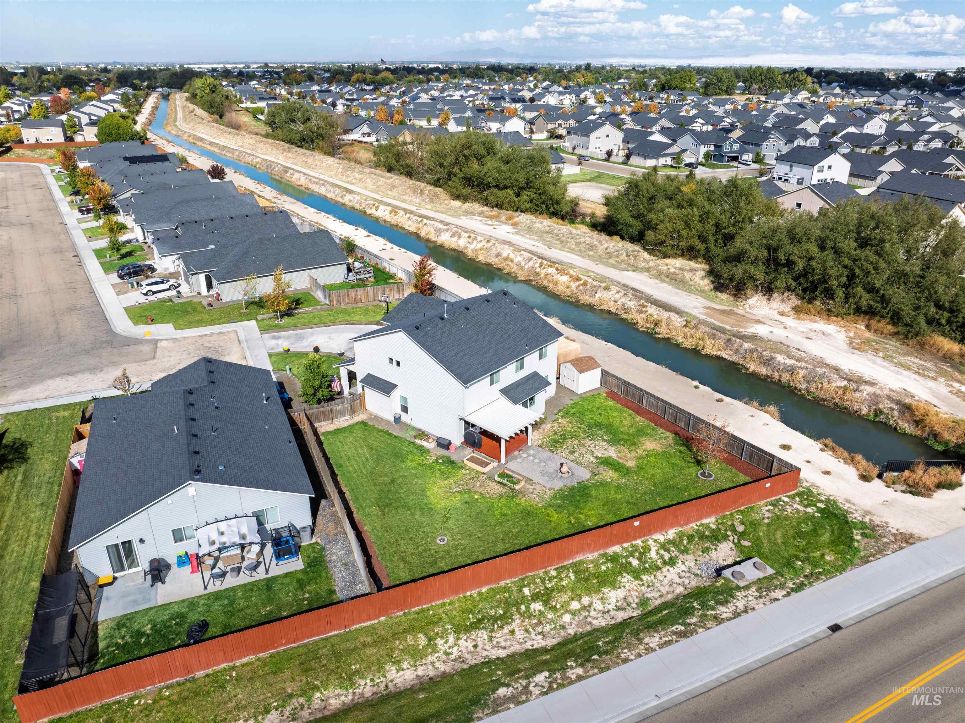 12731 Sondra Street Caldwell, ID 83607 - Photo 40 of 46 Aerial perspective of suburban area featuring a large body of water