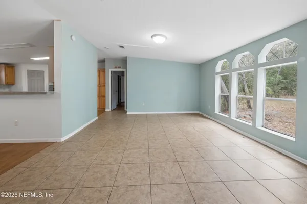 a view of an empty room with a window