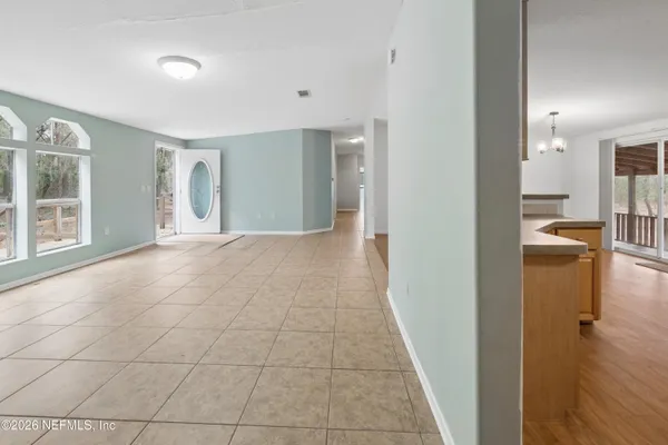 wooden floor in a room with a bathroom