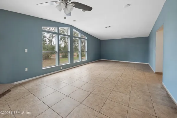 a view of an empty room with a window