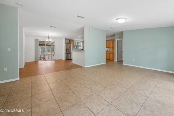 a view of livingroom with an empty space and window