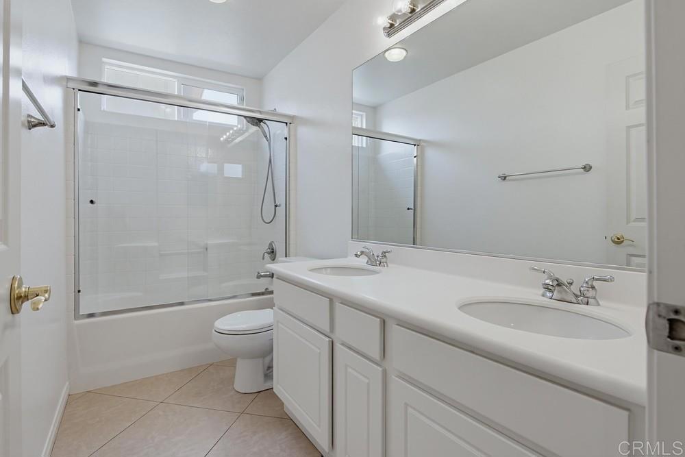 672 Inverlochy Drive Fallbrook, CA 92028 - Photo 50 of 75 a bathroom with a sink toilet and shower