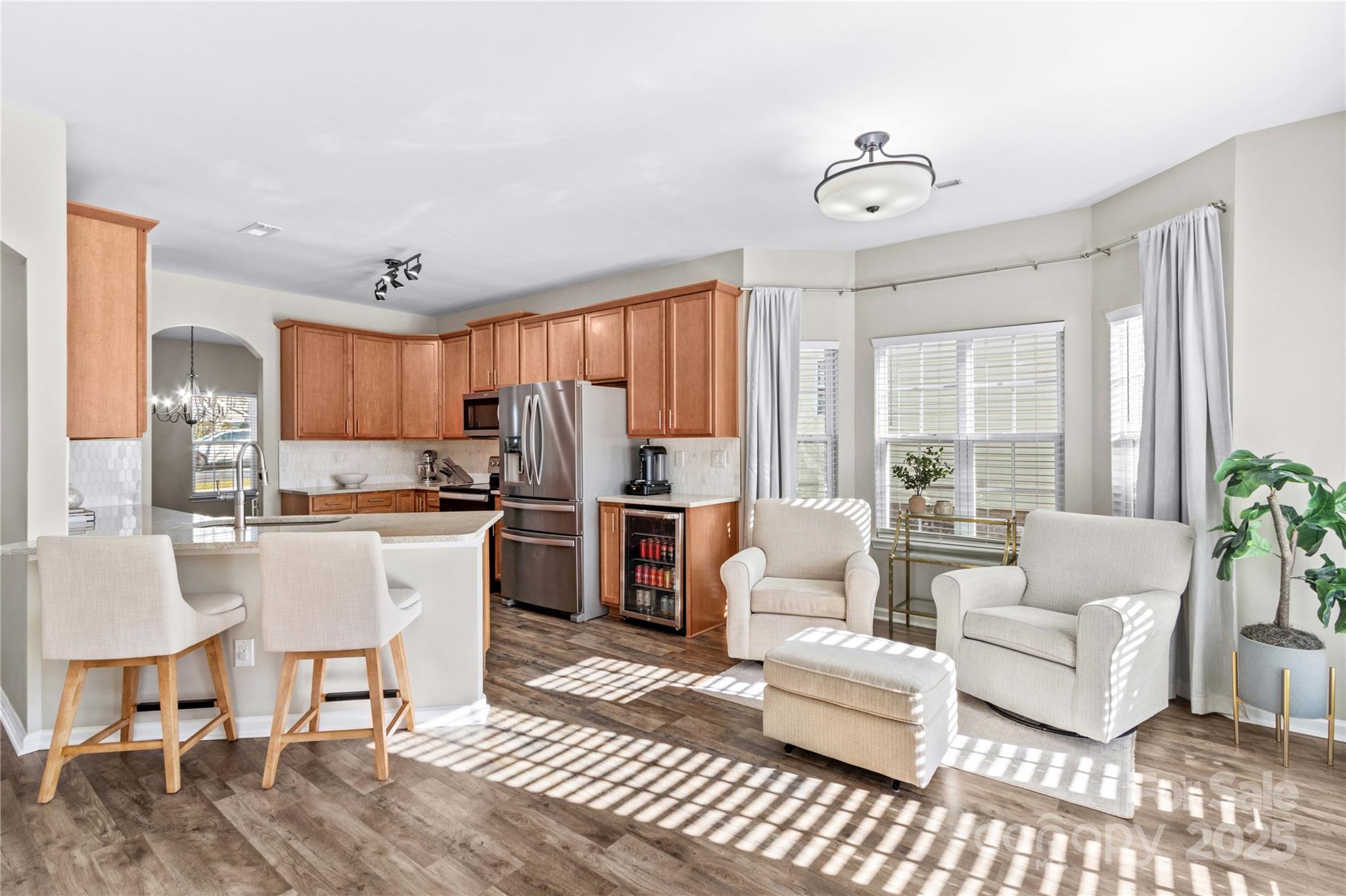 19510 Deer Valley Drive Cornelius, NC 28031 - Photo 16 of 48 a living room with furniture a large window and a dining table